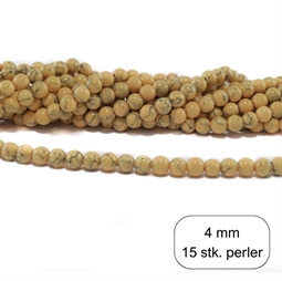 Små 4 mm gule perler. Der er 15 stk.løse perler i posen.