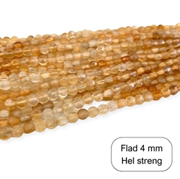 Flade runde Citrin perler. De måler ca. 4 x 2,5 mm Der er ca. 100 perler på strengen der er 40 cm. lang.