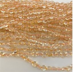 Flade runde Citrin perler. De måler ca. 4 x 2,5 mm Der er ca. 100 perler på strengen der er 40 cm. lang.