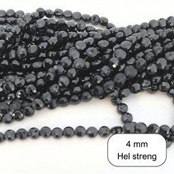 Flade runde Sort spinel perler. De måler ca. 4 x 2,5 mm Der er ca. 100 perler på strengen der er 40 cm. lang.
