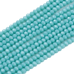 Små mørk turkisblå glasperler. Der er ca. 170 perler på strengen