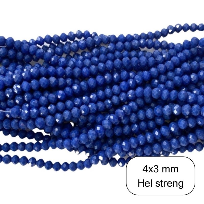 Koboltblå glasperler. Perlerne måler 6 x 4 mm
